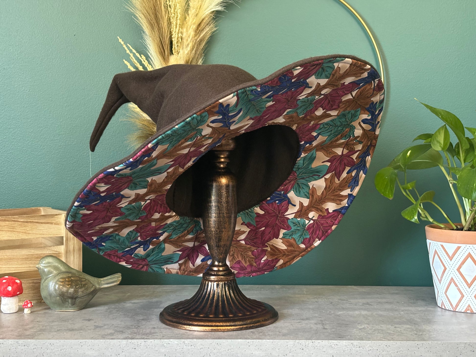 Dark brown witch hat or wizard hat made with soft fleece fabric, featuring a top cone section without any folds. The hat is customizable in various colors, including the underside of the brim, with additional fabric options available for a personalized touch.